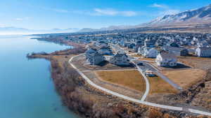 Birds eye view of property with a residential view and a water and mountain view