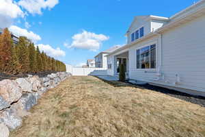 View of yard featuring a patio area and fence