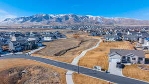 Drone / aerial view with a residential view and a mountain view