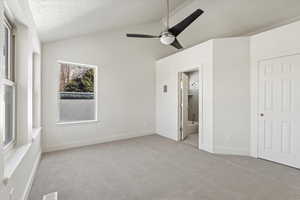 Bedroom with lofted ceiling, ensuite bathroom and walk-in closet