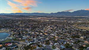 Aerial view at dusk with a residential view and a water and mountain view