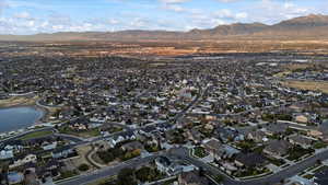 Drone / aerial view featuring a residential view and a water and mountain view