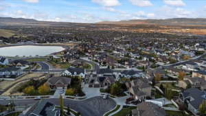 Birds eye view of property featuring a residential view and a water and mountain view