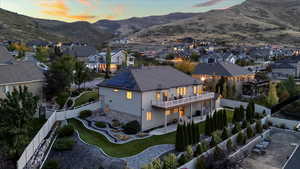 Aerial view at dusk with a residential view and a mountain view