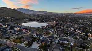 Aerial view at dusk with a residential view and a water and mountain view