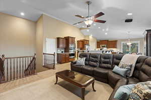 Living area featuring a ceiling fan, recessed lighting, high vaulted ceiling, and light tile patterned floors