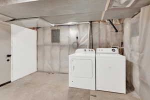 Clothes washing area with laundry area, independent washer and dryer, and electric panel