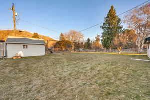 View of yard with fence