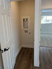 Clothes washing area with laundry area, washer hookup, electric dryer hookup, and baseboards