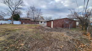 View of yard with fence