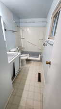 Bathroom with visible vents,  shower combination, toilet, and tile patterned floors