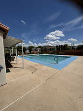 View of pool featuring a patio area and a fenced in pool