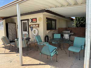 View of patio / terrace with outdoor dining space and grilling area