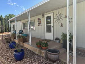 Entrance to property featuring a porch