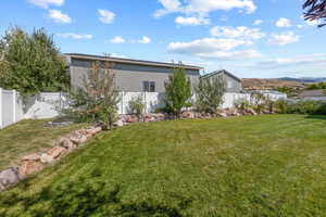 View of yard with a fenced backyard