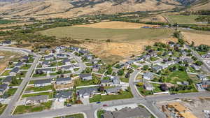 Birds eye view of property with a residential view and a mountain view