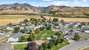 Birds eye view of property with a residential view and a mountain view