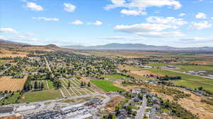 Birds eye view of property featuring a residential view and a mountain view