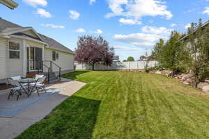 View of yard featuring a patio area and a fenced backyard