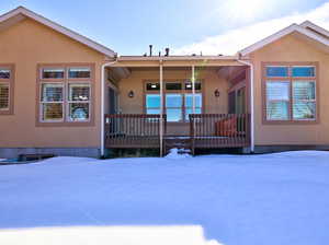 Covered Back Deck with Entrances from kitchen and Primary Suite
