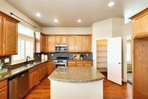 Kitchen with Granite Countertops, Pantry and Stainless Appliances