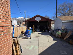 Exterior space with driveway and fence