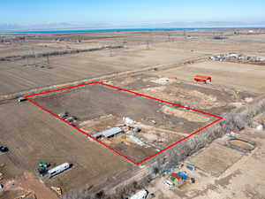 Birds eye view of property featuring a rural view