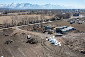 Birds eye view of property with a rural view and a mountain view