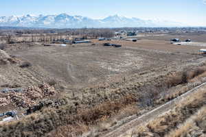 Aerial view featuring a rural view and a mountain view