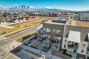 Birds eye view of property with a residential view and a mountain view