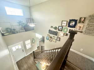 Entrance foyer featuring dark wood-type flooring and baseboards