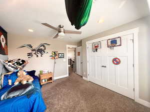 Unfurnished bedroom featuring a textured ceiling, carpet floors, recessed lighting, and baseboards