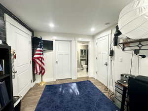 Interior space with baseboards and wood finished floors