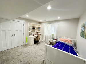 Bedroom with recessed lighting and light carpet