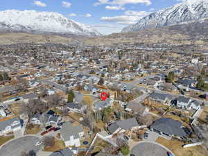 Birds eye view of property with a residential view and a mountain view