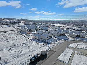 Snowy aerial view with a residential view and a mountain view