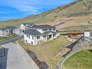 Birds eye view of property with a mountain view