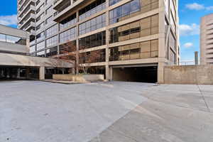 View of building exterior featuring an attached garage