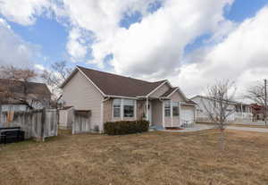 View of front of house with a front yard