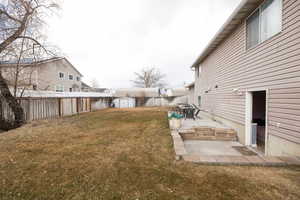 View of yard featuring a patio area and a shed