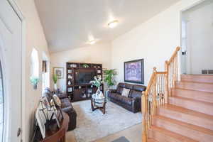 Living room with lofted ceiling