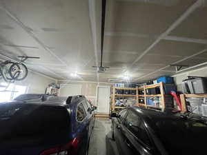 Garage featuring a garage door opener