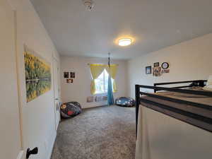 #2 Bedroom featuring carpet floors, baseboards, and a textured ceiling