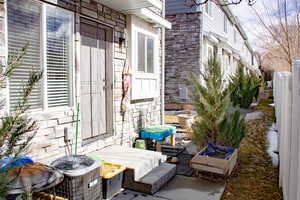 View of Back patio with central AC. Partially fenced.