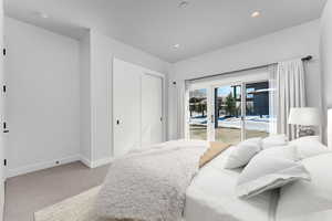 Carpeted bedroom featuring access to outside and recessed lighting