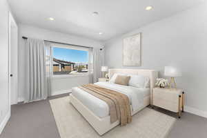 Carpeted bedroom with baseboards and recessed lighting