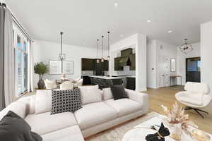 Living area with a chandelier, light wood-type flooring, and recessed lighting