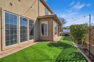 Exterior space featuring a fenced backyard and a hot tub