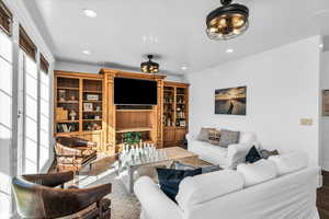 Living area featuring recessed lighting and wood finished floors