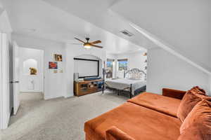 Bedroom featuring ceiling fan, visible vents, baseboards, and light colored carpet